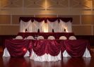 Custom satin backdrop with brocade draping.