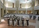 Ivory chair covers and black organza sashes tied in an elegant knot.  Arcadian Court. Toronto.