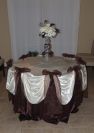 Sweet table decorations by www.decor-rent.com
Chocolate satin and ivory satin draping with chocolate organza decorative bows. Custom centerpiece by www.decor-rent.com flowers.