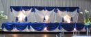 White Satin Wall Draping. Satin Backdrop with matching Head Table. Specialty Ligthing. (by www.decor-rent.com)